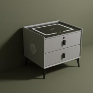 A light grey smart bedside table with two drawers, black legs, and a black glass top with a lighted wireless charging pad, is aesthetically positioned in front of a dark olive green wall. The side panel is visible, and soft shadows are cast across the background.
