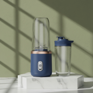 A modern blue portable blender with a rose gold ring accent, standing next to a matching clear travel cup with a dark blue lid. Both are placed on a white marble pedestal against a textured olive green wall, highlighted by natural light.