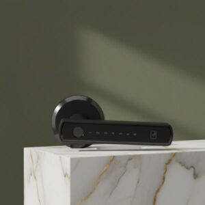 A black smart door lock handle resting casually on a white marble pedestal with gold veining, set against an aesthetic olive green background with soft sunlight shadows.