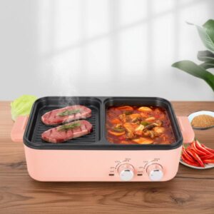 A close-up view of the pink dual-zone cooker on a wooden table, with meat searing on the right side and a stew or braise cooking on the covered left side.