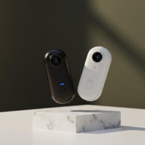 A black action camera and a white action camera are levitating in mid-air above a square white marble block. The background is a dark olive green wall with soft shadows.