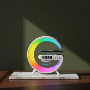A white, crescent-shaped smart device featuring a vibrant rainbow RGB light display, resting on a white marble plinth in a shadowed studio setting.
