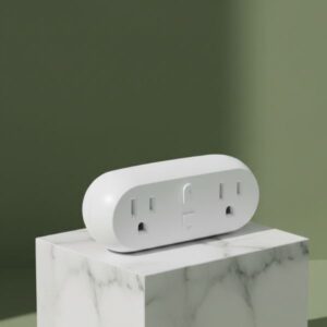 A white, oval-shaped smart power strip with multiple outlets rests aesthetically on a white marble block with soft black veins. The background is an olive green wall with subtle shadows, creating a clean and modern look.