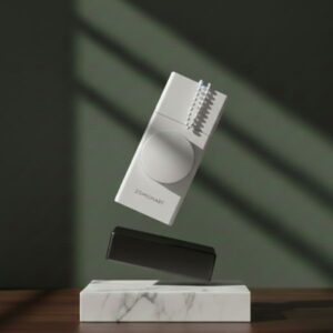 An artistic, floating studio shot of the rectangular white blind motor tilted at an angle, showcasing its depth and clean, modern design against a dark green background.