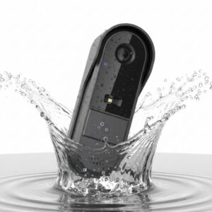 The vertical black smart doorbell unit is shown splashing into a pool of water, creating a large, dynamic crown-shaped splash, to demonstrate its water resistance.