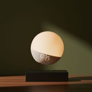 A glowing, spherical smart clock or light levitating above a rectangular black base on a dark wooden surface. The device displays '10:35'. The background is a solid, dark olive-green wall.