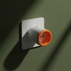 A white smart plug with an open orange top and exposed internal prongs is securely attached to a wall socket. The wall is a dark olive green, illuminated by strong, aesthetic shadows.