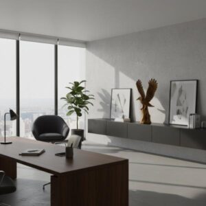 A bright, modern minimalist office interior with large windows, a dark wooden desk, a black leather chair, and a long grey credenza with framed artwork, including a stylized eagle image, on top.