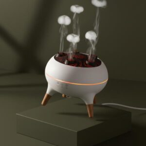 White smoke ring diffuser standing straight on a low matte green block with the background matching the dark olive green aesthetic, emitting smoke rings.