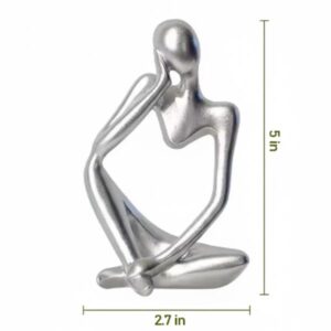 Isolated image of the silver abstract figure with white background showing the dimensions: 5 inches high and 2.7 inches wide.