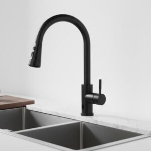 Sleek black kitchen tap installed in a stainless steel sink with a wooden cutting board nearby and a blurred white background.