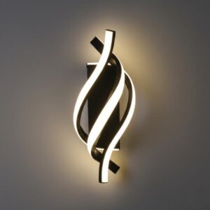 A close-up, slightly angled shot of a chrome spiral wall light emitting warm white light on a grey background.